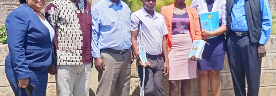 Chairman,Public Service Commission ,Amb.Anthony Muchiri and Dr.Mary Mwiandi pose with interns posted at the University of Nairobi Kisumu Campus